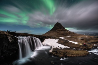 aurora borealis exploded on the mountain like the volcano eruption / kirkjufell one of the most famous landmark in iceland / landscape photography