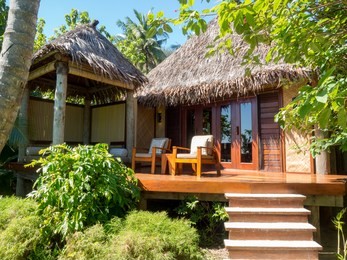 south pacific tropical island bure bungalow deck with day bed in fiji