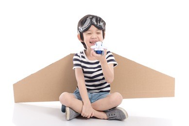 cute asian child wearing aviator costume on white background isolated