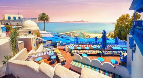 panoramic view of seaside and cafe terrace in sidi bou said at sunset. tunisia, north africa  