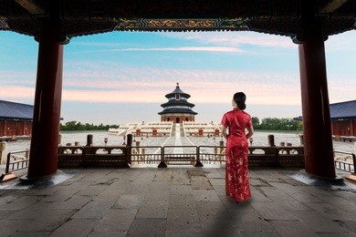 asian young woman in old traditional chinese dresses in the temple of heaven in beijing, china.
