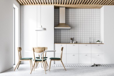 white kitchen interior with white countertops, a table with chairs and a large window. a front view. 3d rendering mock up