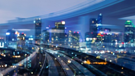 city downtown blurred bokeh light over train track motion double exposure, abstract background