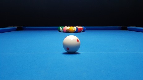 billiard balls on blue billiard table. perfect composition of pool balls.