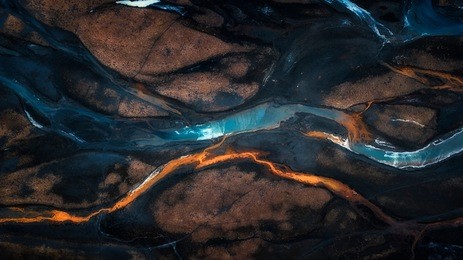 aerial photo of mix color of stream in to river