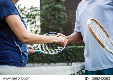 tennis players shaking hands after a good match