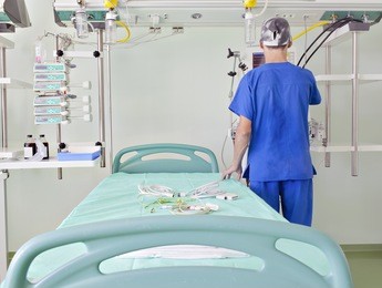 doctor prepare place in an advanced, modern intensive care unit (icu) for emergency patients.