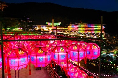 nighttime view of samgwangsa temple in busan city of south korea. thousands of paper lanterns decorate at samgwangsa temple in busan, south korea for buddha's birthday.