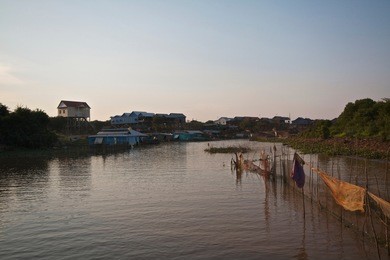 tonle sap floating village is an amazing water world on the banks of a river feeding into the tonle sap lake. houses are built on stilts or float to cope with the huge change in water levels.
