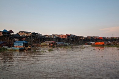 tonle sap floating village is an amazing water world on the banks of a river feeding into the tonle sap lake. houses are built on stilts or float to cope with the huge change in water levels.