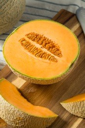 raw orange organic cantaloupe cut into slices