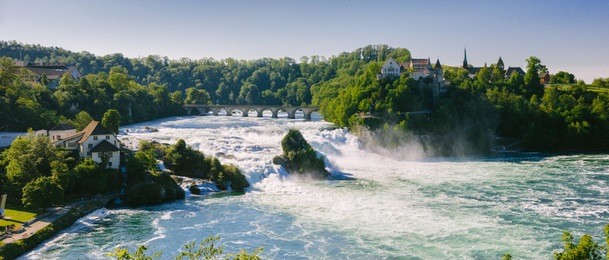 rhine falls is the largest waterafall in europe and a big tourist attraction. the falls are situated on the high rhine, on borders of cantons of schaffhausen and zürich, in northern switzerland