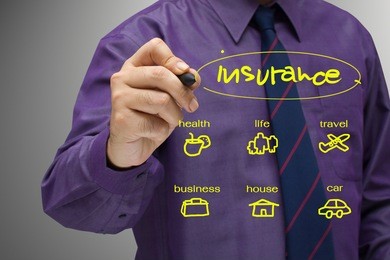 businessman writing an insurance concept