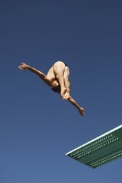 male diver diving of a spring board