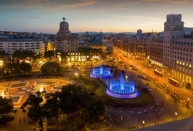 night view of magic illuminated fountains in plaza catalunya in barcelona