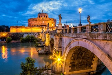 bridge and castle sant angelo in rome. sant angelo bridge at twilight.