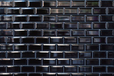 black ceramic tile on the wall in minimalistic style