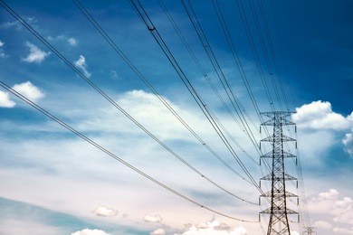 high voltage towers with blue sky