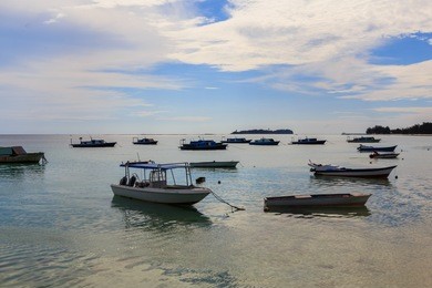 fishing boat in the sea with anchored in beautiful mantanani island, sabah, borneo