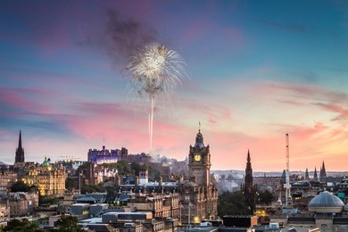 fireworks over edinburgh castle during the military tattoo