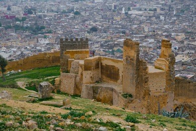 the marinid tombs or merenid tombs refer the ruins of monumental tombs on a hill above and north of fes al-bali, the old city of fez, morocco. 