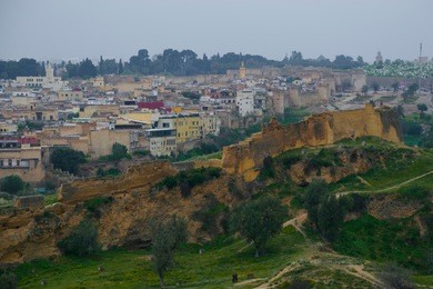 the marinid tombs or merenid tombs refer the ruins of monumental tombs on a hill above and north of fes al-bali, the old city of fez, morocco. 