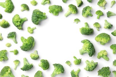 flat lay composition with fresh green broccoli on light background