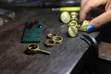goldsmith checking ring after casting