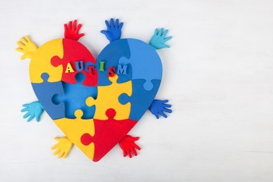 puzzle heart hands support autism awareness