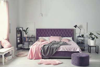 interior of beautiful room with comfortable double bed