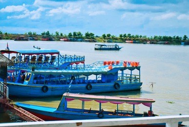 passenger boat parked at the pier at tonle sap lake, cambodia, september 2016