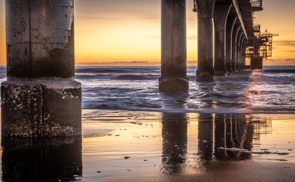 new brighton pier, christchurch, new zealand. long exposure sunrise, hdr