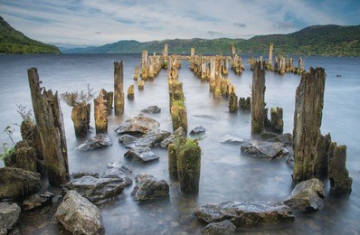long exposure photography. dramatic view of broken pier in loch ness, highlands, scotland