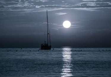 beautiful night adriatic sea, yacht  and full moon, croatia. night seascape. 
