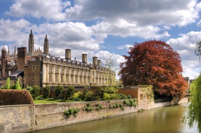 clare college, cambridge university, england
scenic view of old buildings in city of cambridge with river in foreground, spring scene, england.