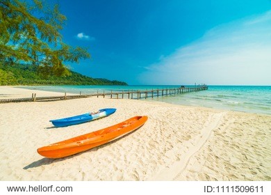 beautiful nature tropical beach and sea with kayak boat and coconut palm tree on paradise island for travel vacation