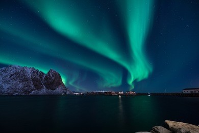 snow mountain with aurora in the background/ travel concept world explore northern light