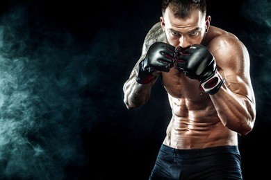 sportsman boxer fighting on black background. copy space. boxing sport concept.