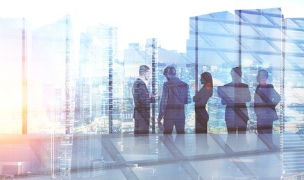 diverse business team members are discussing company development strategy together in a modern office with panoramic windows. cityscape foreground. toned image double exposure mock up