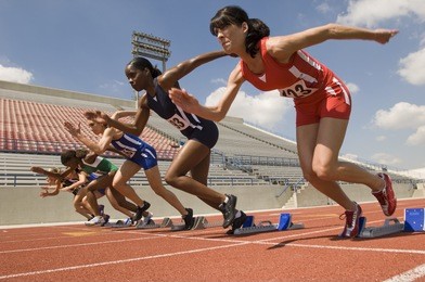 group of female runners starting the race