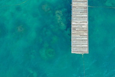 top view of jetty with clear sea water