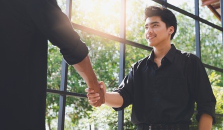 business negotiation,image of asian businessmen handshaking,happy with work,handshake gesturing people connection deal concept.