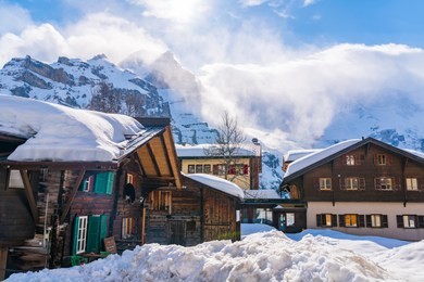 view of snowy murren village in sunny day with the beautiful high mountain in the background