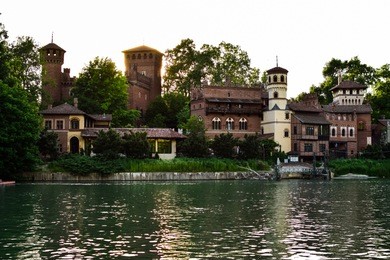 view from the other side of the valentino castle, blocking the sun by one of its towers. photograph taken at the valentino park, in turin, italy.