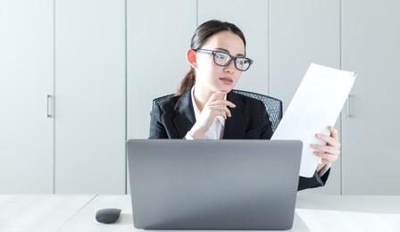 businesswoman reading a document.