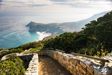 stones steps going to the the rocks cliffs at the cape of good hope in south africa.