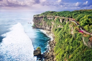 picturesque bright cliff landscape uluwatu bali, indonesia. sightseeing in indonesia. sunset in bali, view of the ocean and the colorful sky, the concept of travel.
