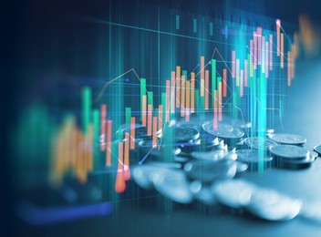 double exposure image of stock market investment graph and coins stack,concept of business investment and stock future trading.