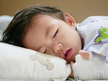 sick asian baby girl, 15 months old, breathing through her mouth as she has nasal congestion and does not know how to breathe through her mouth just yet