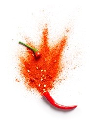 chili powder bursting out of a red chili pepper
